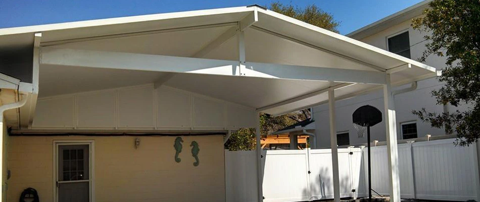 This aluminum carport in Plant City, FL protects the homeowner's vehicle.